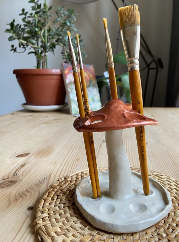 Handmade mushroom shaped holder made of clay for pens, brushes, markers, and pencils, perfect for home decor and desk organization.