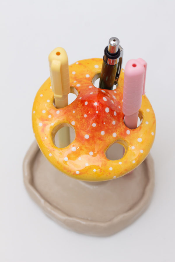 Handmade mushroom shaped holder made of clay for pens, brushes, markers, and pencils, perfect for home decor and desk organization.